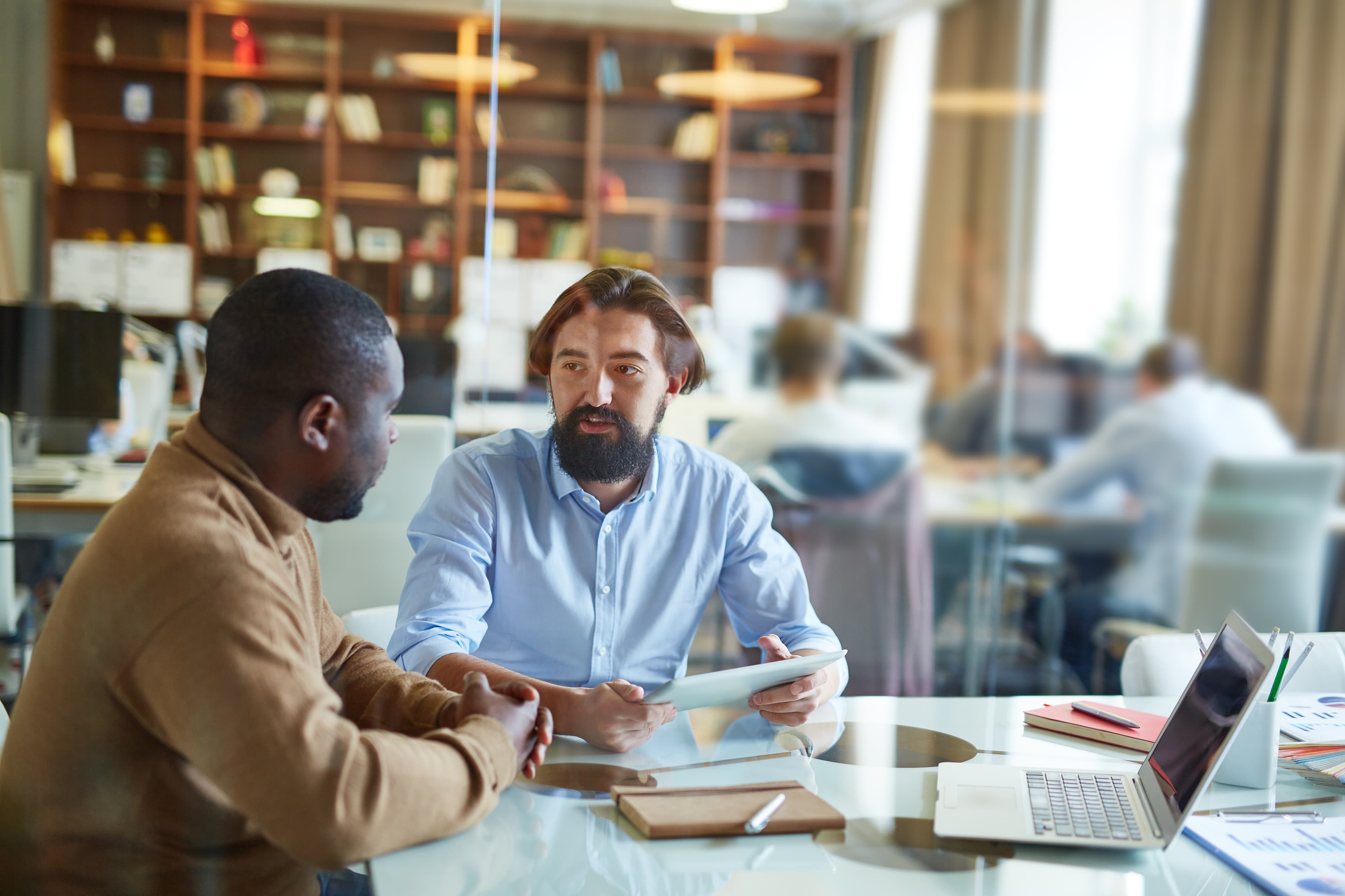 Advisors in discussion at a client's office